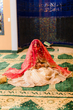 Bride in Red Dupatta and Gold and White Lehenga