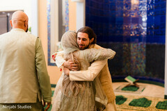 Man Embraces Woman in Intimate Moment