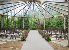 Outdoor Ceremony Tent with Floral Aisle and Arch