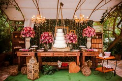 Rustic Chic Cake Table with Lush Pink Floral Arrangements