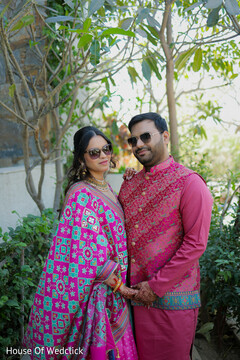 Couple in Pink Attire and Sunglasses