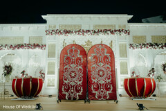 Ornate Red and Silver Panels Adorn a Wedding Stage