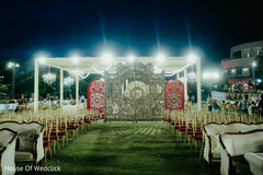 Ornate Backdrop for an Outdoor Wedding Setup