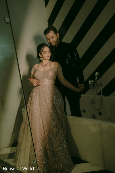 couple portrait,light-colored gown,black suit,indoor photoshoot,pre-wedding fashion