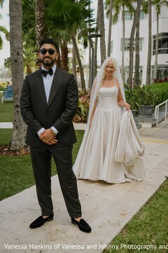 First Look: Groom's Stylish Charcoal Suit and Bride's Elegant White Gown