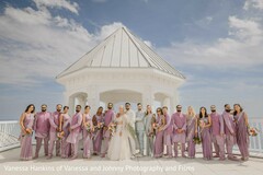 Bridal Party in Lavender and Light-Colored Attire at White Gazebo
