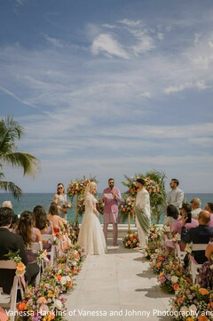Oceanfront Ceremony with Vibrant Floral Aisle Decor