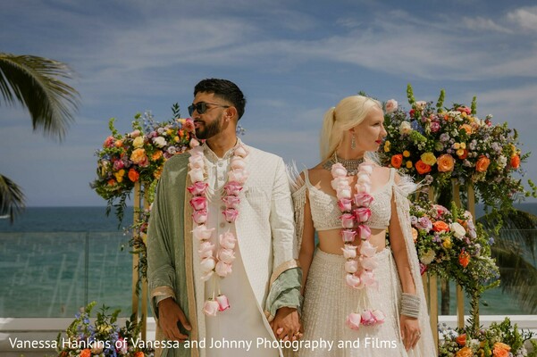 floral decor,floral garlands,outdoor,bride,groom,white lehenga choli,white kurta,light green dupatta