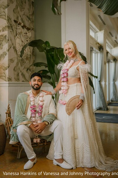 wedding fashion,off-white lehenga,mint green shawl,floral garlands,couple portrait,bridal jewelry,groom fashion,elegant wedding