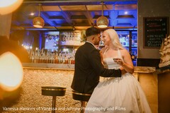 Couple Poses by a Bar with Mixed Lighting
