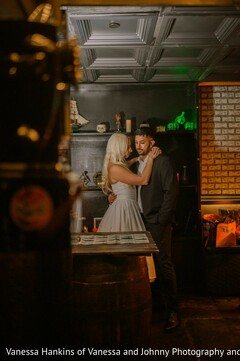 Couple Embraces in a Dimly Lit Bar