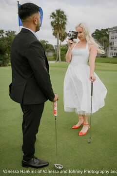 Woman with Vintage Camera and Golf Iron on the Green