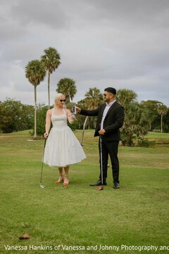 Couple on Golf Course with White Midi Dress and Black Suit