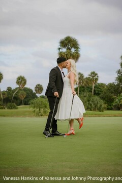 Couple Kisses on Golf Course in White Short Dress and Black Tuxedo