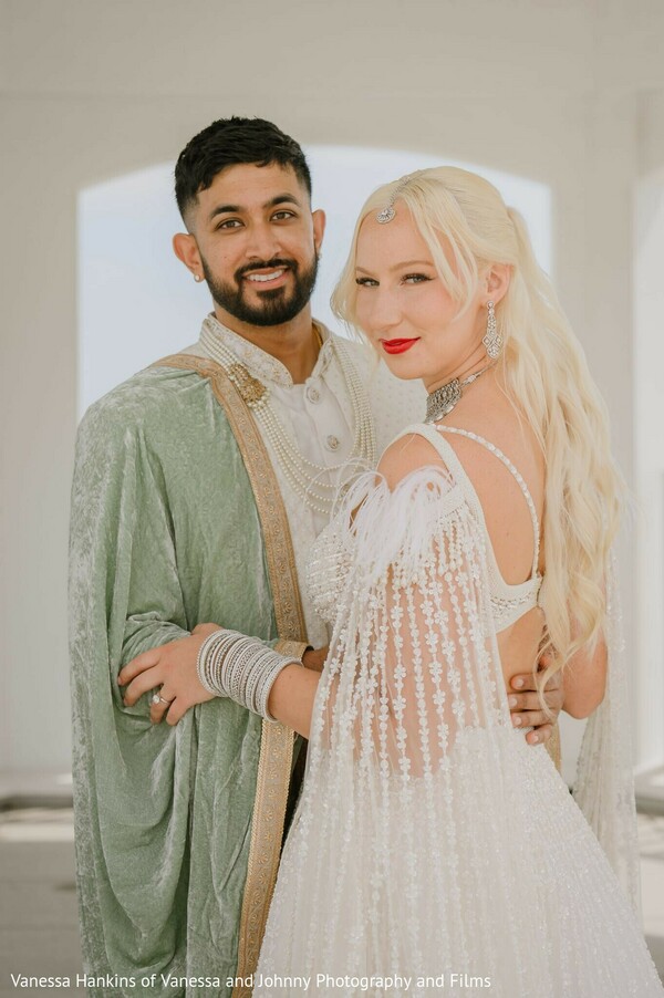 south asian wedding,bridal fashion,groom fashion,white lehenga,mint green sherwani,bridal jewelry,groom jewelry,couple portrait,wedding attire,modern bridal