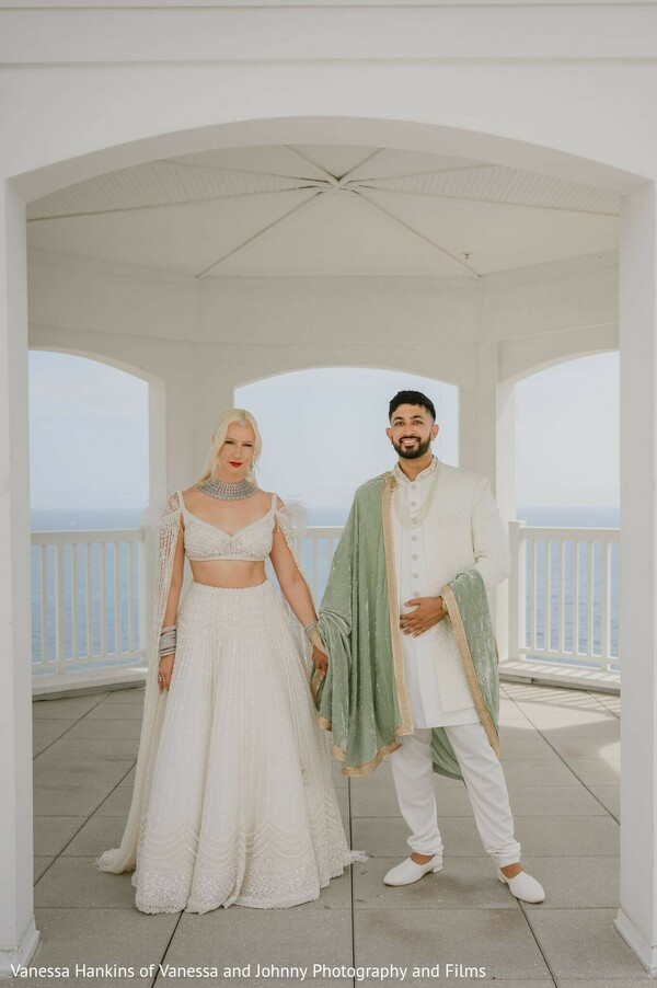 couple portrait,white lehenga,white sherwani,sage green shawl,water view,gazebo,wedding attire