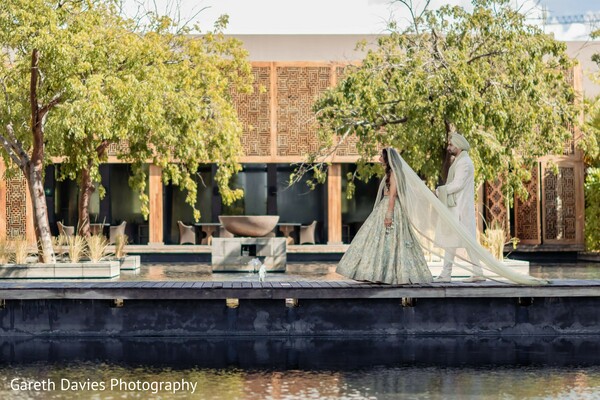 couple portrait,lehenga,water feature,greenery,wedding attire