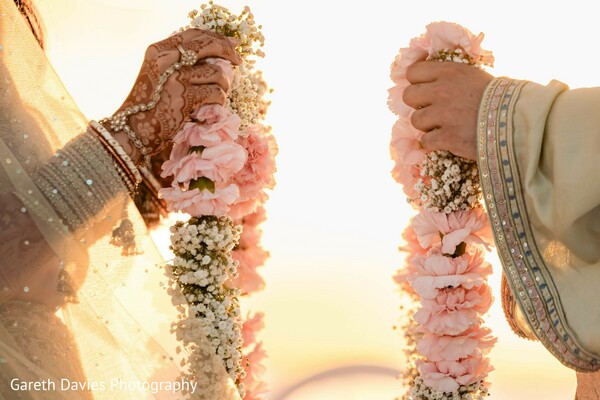 floral garlands,pink flowers,white flowers,bridal bangles,ceremony details