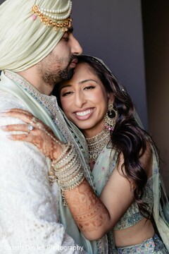 Couple's Embrace: Bride in Mint Green Lehenga and Groom in Mint Green Sherwani