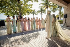 Bridal Party in Pastel Sarees Clapping for Couple
