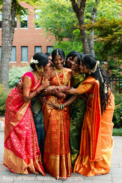 sari,gold jewelry,floral hair,colorful saris,women,embrace