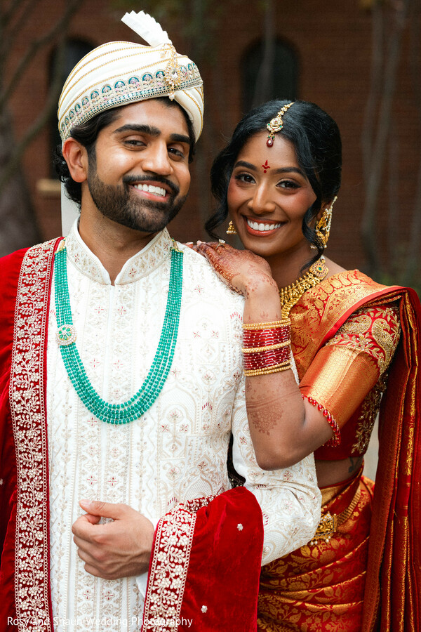 wedding,couple portrait,red sari,ivory sherwani,bridal jewelry,groom fashion,wedding fashion,gold jewelry,turquoise necklace