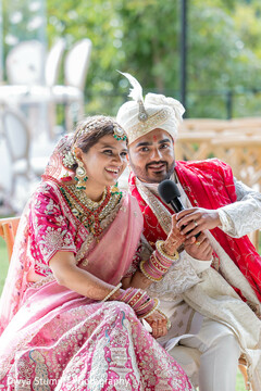 Joyful Couple in Pink and Ivory South Asian Wedding Attire