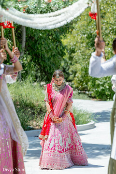 Blushing Pink Bridal Entrance with Intricate Lehenga Detail