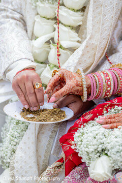 Couple's Hands with Mehndi and Floral Details