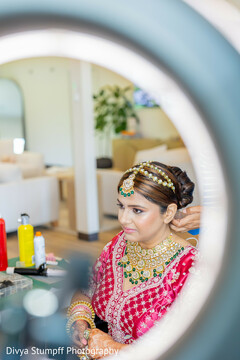 Stunning Bridal Look with Intricate Gold and Emerald Jewelry