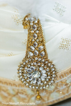 Gold and Crystal Bridal Jewelry on Embroidered Fabric