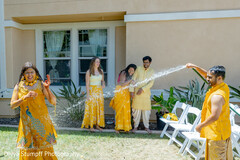 Playful Water Splash During Outdoor Gathering