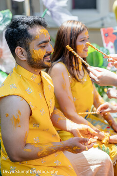 Couple Covered in Turmeric Paste During Celebration
