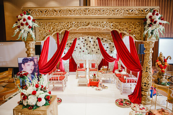 mandap,red decor,gold decor,floral decor,floral arrangements