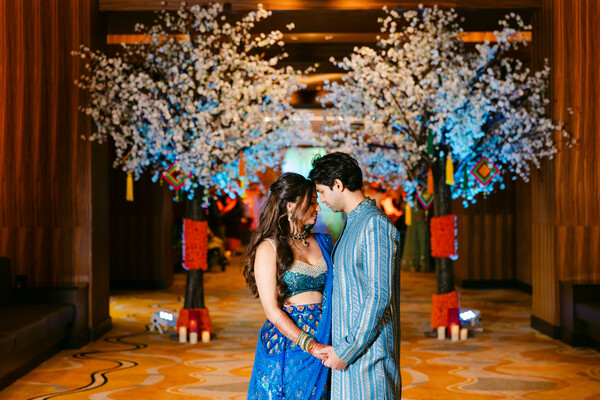 couple portrait,blue lehenga,blue kurta,wedding decor