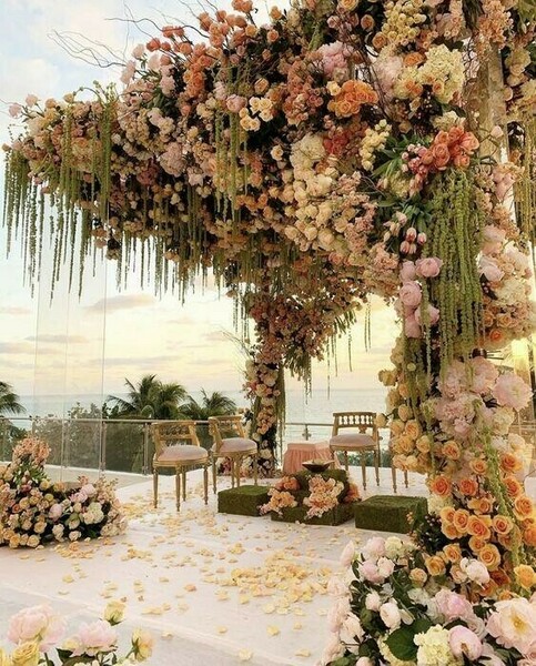 floral decor,outdoor ceremony,cream flowers,blush flowers,pink flowers,hanging greenery,ceremony,wedding inspiration,petals