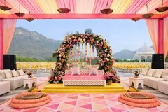 Outdoor Wedding Stage with Floral Arch and Pink and Yellow Decor