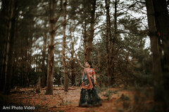 Bride in a Dark Blue Lehenga with Orange Embroidery in a Forest