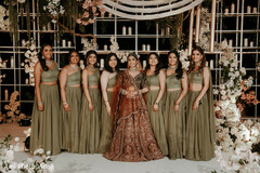 Maharani in Maroon Lehenga with Bridesmaids in Olive Green Lehengas