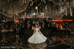 Elegant Ballroom Reception with Floating White Gown & Dramatic Lighting