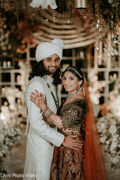 Elegant Couple Portrait with Intricate Maroon Lehenga and White Sherwani