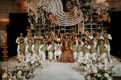 Bridal Party Poses with Floral and Candle Decor