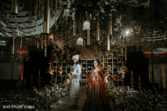 Couple on Stage with Elegant Floral and Gold Decor