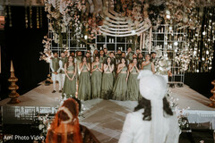 Bridal Party in Olive Green Lehengas with Floral Stage Decor
