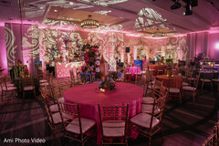 Vibrant Pink Reception Decor with Ornate Lighting Projections