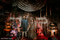 Couple's Elegant Entrance Amidst Rustic Floral Decor
