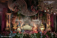 Elaborate Reception Stage with Ornate Archways and Floral Decor
