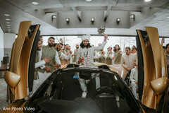 Groom's Grand Entrance in a Bronze Sports Car
