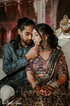 Couple in Patterned Attire with Groom Gently Touching Bride's Face