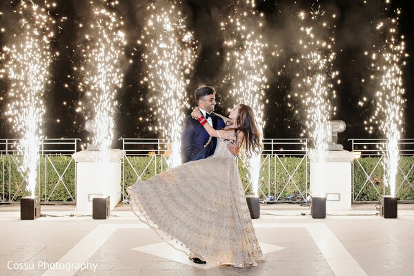 reception,couple dance,indoor fireworks,evening event,wedding celebration,lighting,special effects,reception fashion,groom fashion,portraits